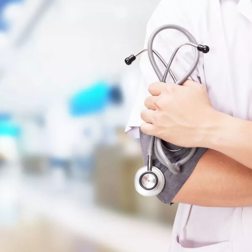 doctor-with-stethoscope-hands-hospital-background